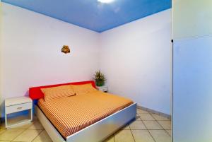 A bed or beds in a room at Residence Giuliana
