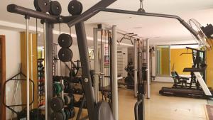 a gym with a bunch of equipment in a room at Ed. Boulevar Antares II in Brasília