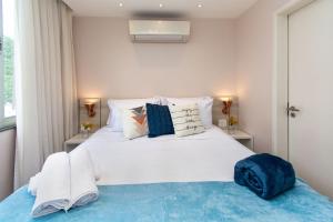 Cama o camas de una habitación en Urca Design - Luxo, Garagem, Piscina