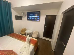 Postelja oz. postelje v sobi nastanitve Manantial Hostal No.004