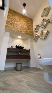 a bathroom with a sink and some skylights at Casa Doña Elena in Bernal