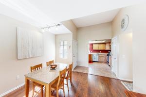 a kitchen and dining room with a table and chairs at Ventana Canyon Respite in Tucson