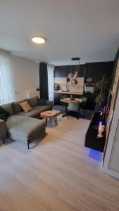 Część wypoczynkowa w obiekcie Superbe appartement dans un quartier neuf et calme