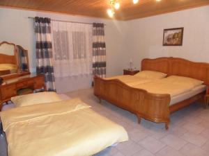 Postel nebo postele na pokoji v ubytování Haus Rottenstein + 22 fotografií