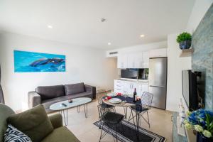 a living room with a couch and a table at Seafront Flat with Excellent Sea View in Bodrum in Bodrum City