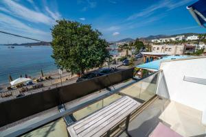 a balcony with a view of the water at Seafront Flat with Excellent Sea View in Bodrum in Bodrum City