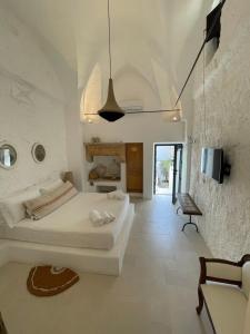 A bed or beds in a room at Corte Manfredi Még 37 kép