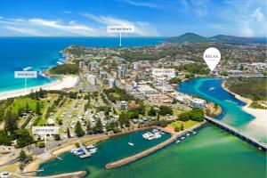 an aerial view of a resort with a harbor and a city at BJ Mick's Lakefront Apartment in Forster