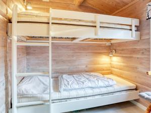 a bedroom with bunk beds in a cabin at Two-Bedroom Holiday home in Læsø 18 in Læsø