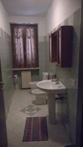 a bathroom with a sink and a toilet at Cannone d'Oro in Sale