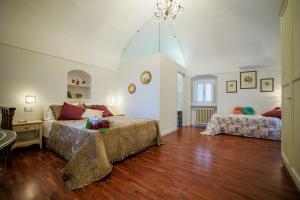 Postel nebo postele na pokoji v ubytování B&B CORSO VITTORIO