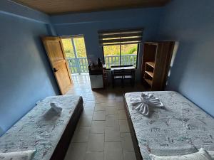 Postelja oz. postelje v sobi nastanitve Hotel Ticozuma
