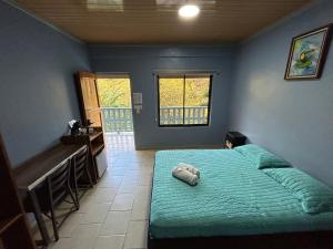 Postelja oz. postelje v sobi nastanitve Hotel Ticozuma