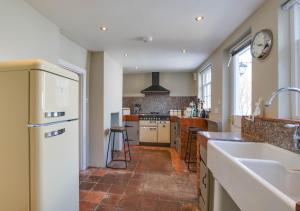 a kitchen with a sink and a counter top at 4 Lambseth Street in Eye