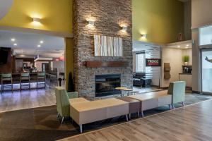 a lobby with a couch and a fireplace at Best Western Plus Dartmouth Hotel & Suites in Halifax