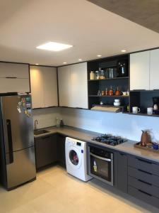 Een keuken of kitchenette bij Apartamento Cruz das Almas