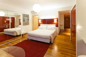 Ένα ή περισσότερα κρεβάτια σε δωμάτιο στο Hotel Nasco