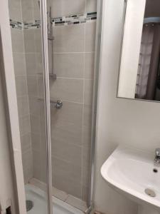 a bathroom with a shower and a sink at Studio Paris 13 in Paris