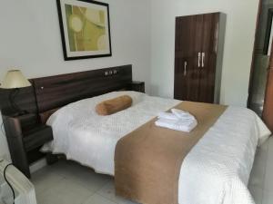 Postel nebo postele na pokoji v ubytování Gran Colonial Riviera