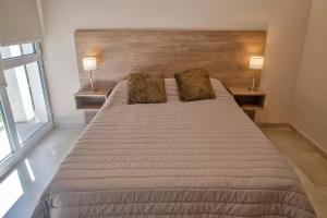 Postel nebo postele na pokoji v ubytování Le Cuyen Flat + 10 fotografií