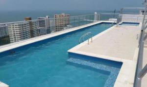 a large swimming pool on the roof of a building at Exclusive House Cartagena in Cartagena de Indias