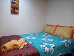 Postel nebo postele na pokoji v ubytování Posada Azul Cusco