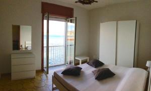 Posteľ alebo postele v izbe v ubytovaní Castello Apartment