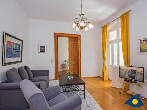 a living room with a couch and a table at Villa Linde Whg 06 in Heringsdorf
