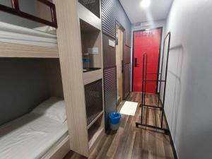 Postel nebo postele na pokoji v ubytování Boxinn The Kontena Home