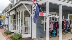 a shop with a flag in front of it at Sugarbush Summit Condo in Warren