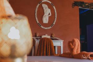 Voodi või voodid majutusasutuse Le Temple d'Opaline toas