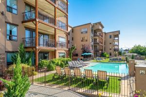 an image of a pool in a apartment complex with patio furniture at Marina's Edge Condo walk to restaurants and wineries condo in Manson