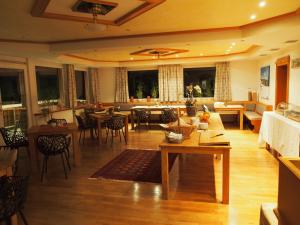 a living room with a couch and a table at Haus Sommerberg in Feldberg