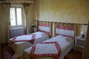 a bedroom with two beds and a window at Lei Meissoun in Mallemort +29 photos