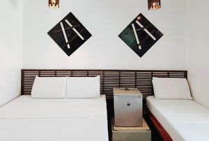 A bed or beds in a room at Hotel Elinas and Restaurant