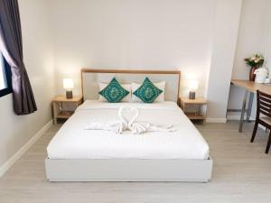 Postel nebo postele na pokoji v ubytování Prinz Garden Villa