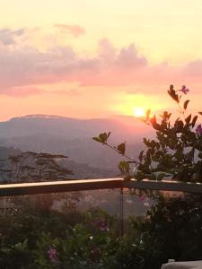 a sunset from the top of a mountain at Skyloft Hostel in Kandy