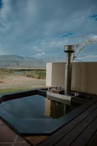 a pool of water sitting on top of a patio at Kwetu Guest Farm in Swellendam