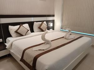 Voodi või voodid majutusasutuse Yuvraj Palace Inn toas
