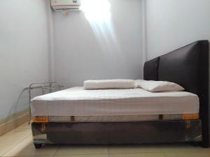 Ein Bett oder Betten in einem Zimmer der Unterkunft Inawa Homestay Syariah