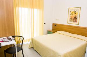 A bed or beds in a room at Residence Il Monello