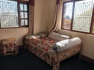 Postel nebo postele na pokoji v ubytování Unique point home stay