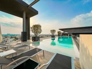 a swimming pool on the roof of a building at FAM Living - City Walk - Luxe Interiors in Dubai