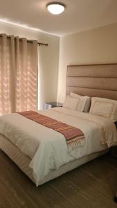 A bed or beds in a room at Cottonwoods Apartment for Family, Friends and Business trips.