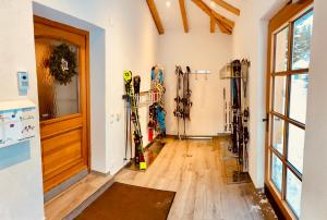 a room with a bunch of skis leaning against the wall at Haus Plattenkar in Obertauern