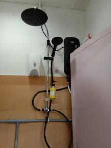 a microphone sitting on the floor in a room at 7Rooms Hotel Budget in Bandar  Pusat Jengka