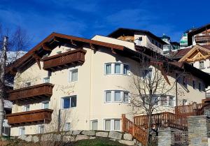 a building with balconies on the side of it at Appartements Plattlerhof in Serfaus