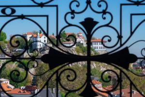 a view of a city through a gate at VIZUALIZA Residence Hotel in Plovdiv