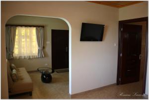 TV a/nebo společenská místnost v ubytování Exotic Guest House