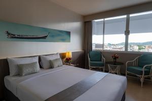 Postel nebo postele na pokoji v ubytování Pearl Hotel Phuket